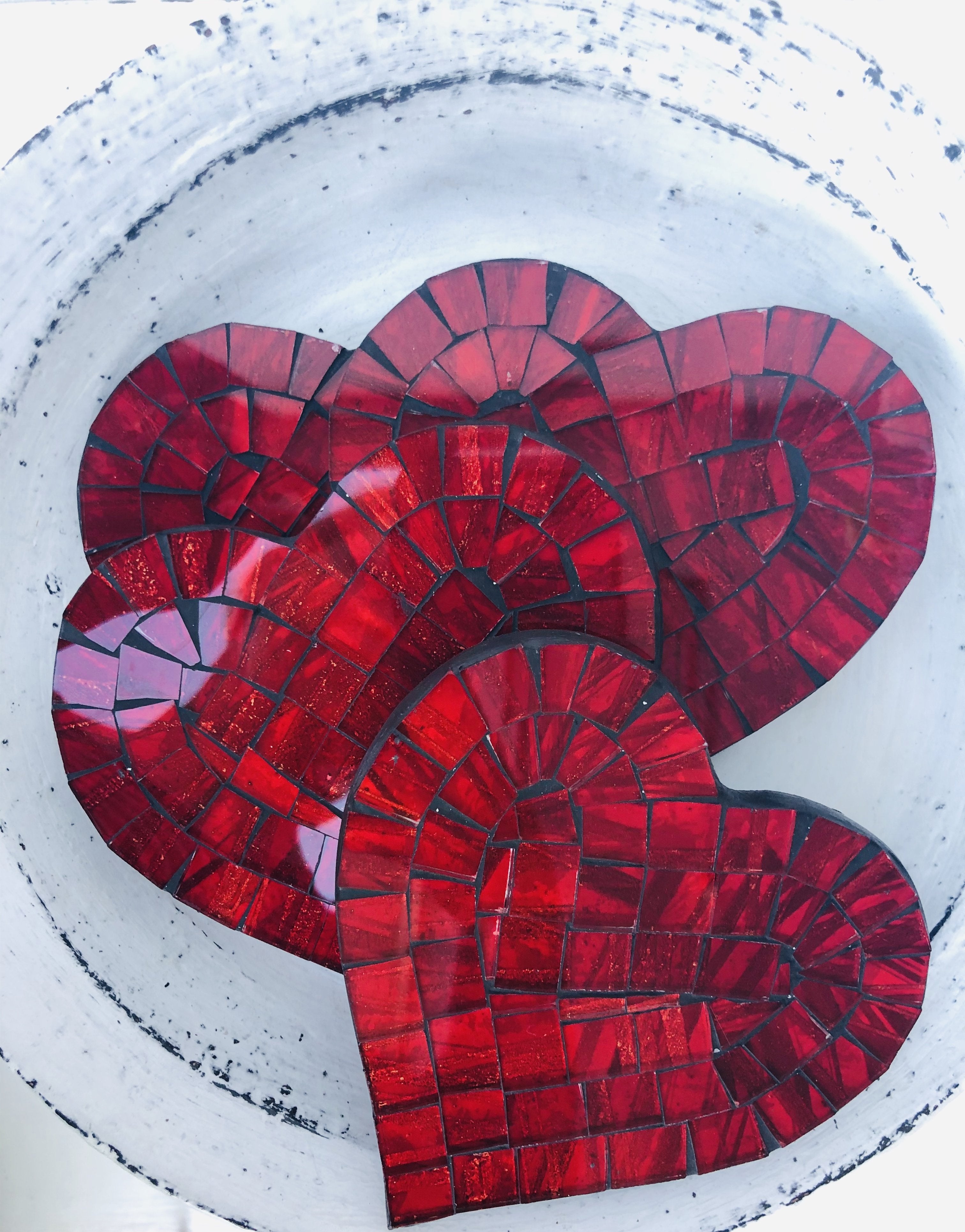 aerial view set of mosaic heart coasters in red