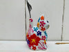 side view of sitting wooden flower kitty