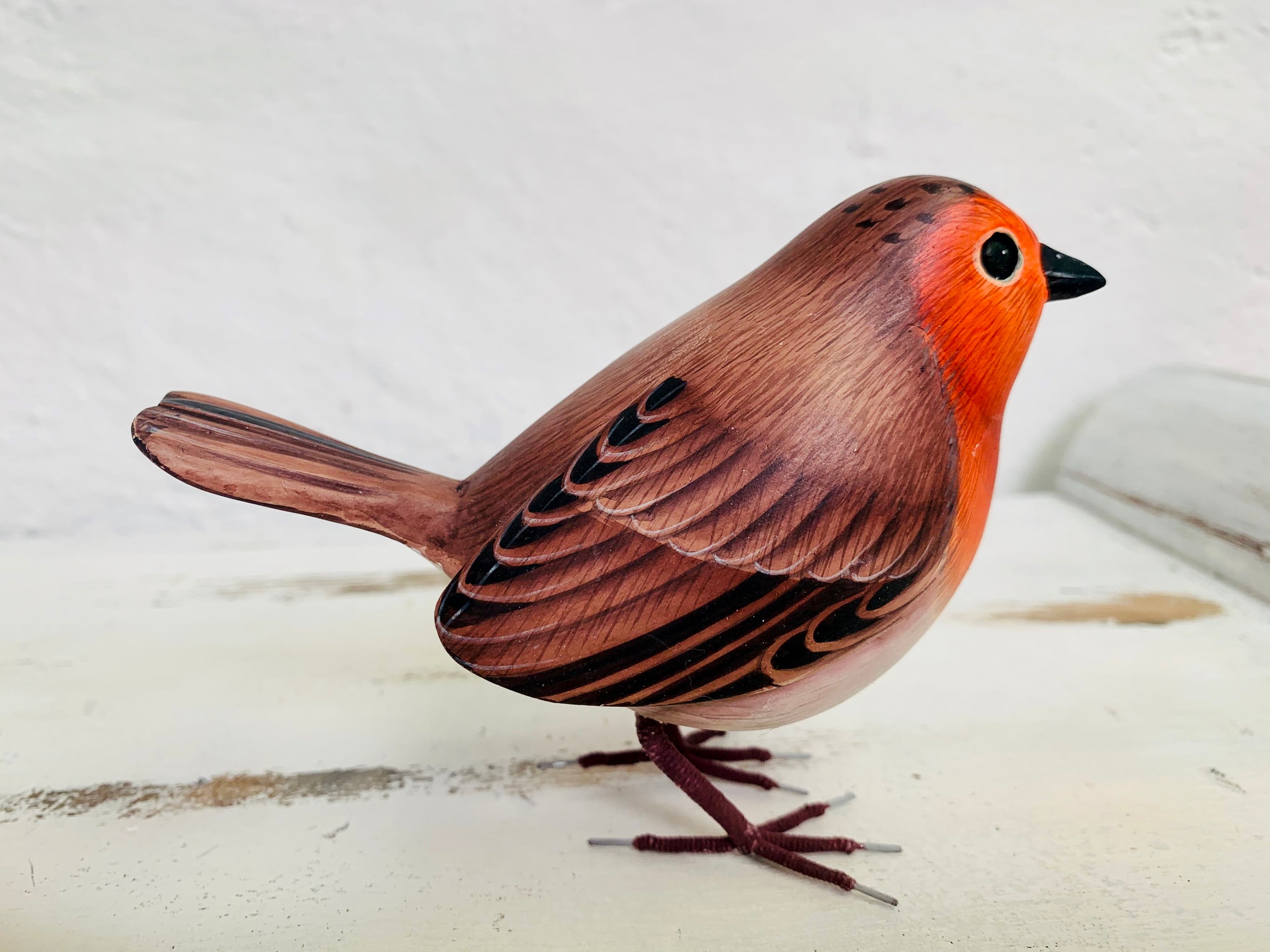 side view of wooden robin