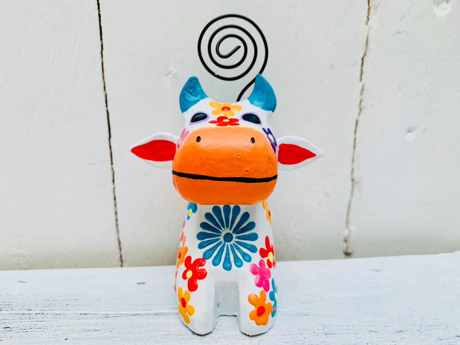 close up front view of wooden flower cow