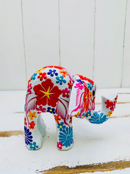 right side view of wooden flower elephant in white