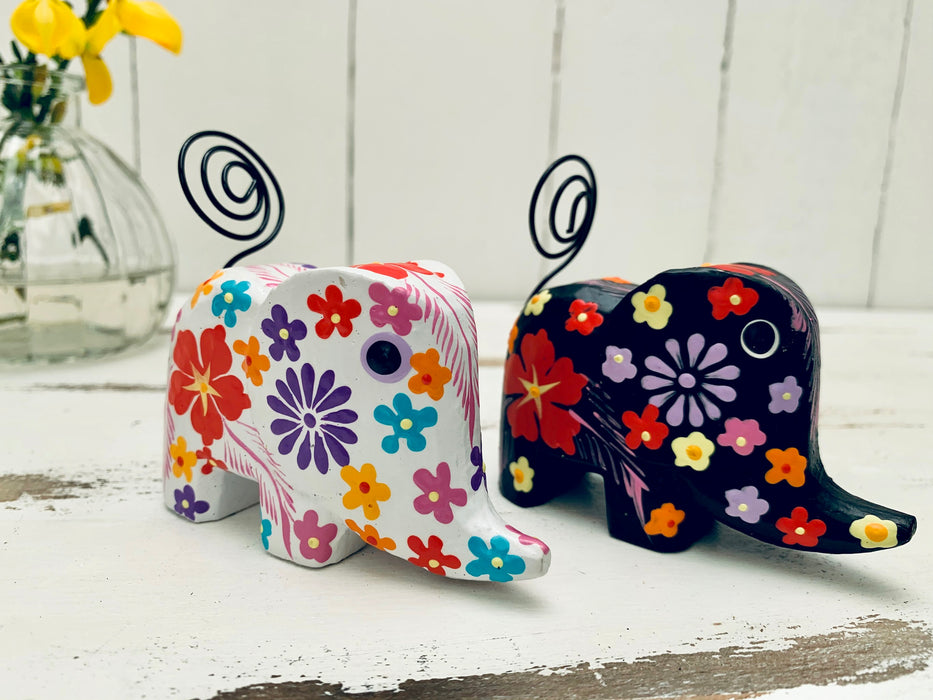 front view of mini flower elephants in white and black