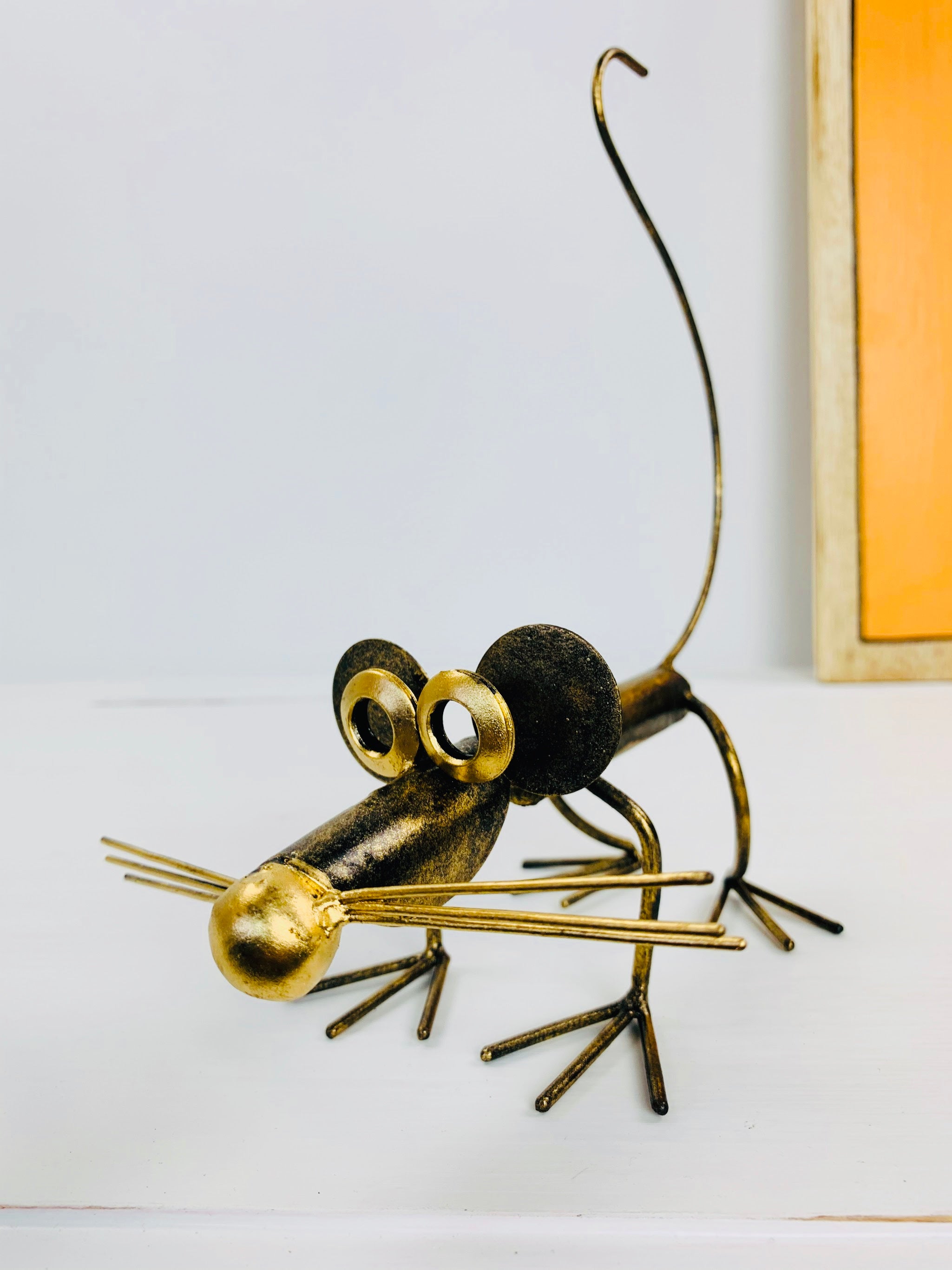 close up of metal mouse basil