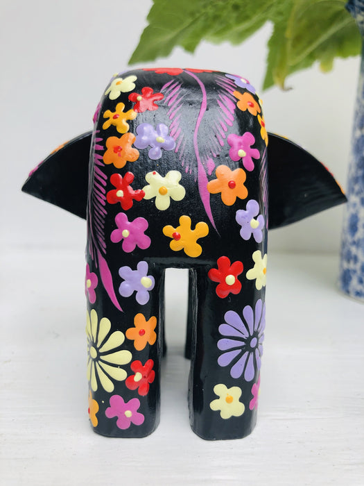 back view of wooden flower elephant in black