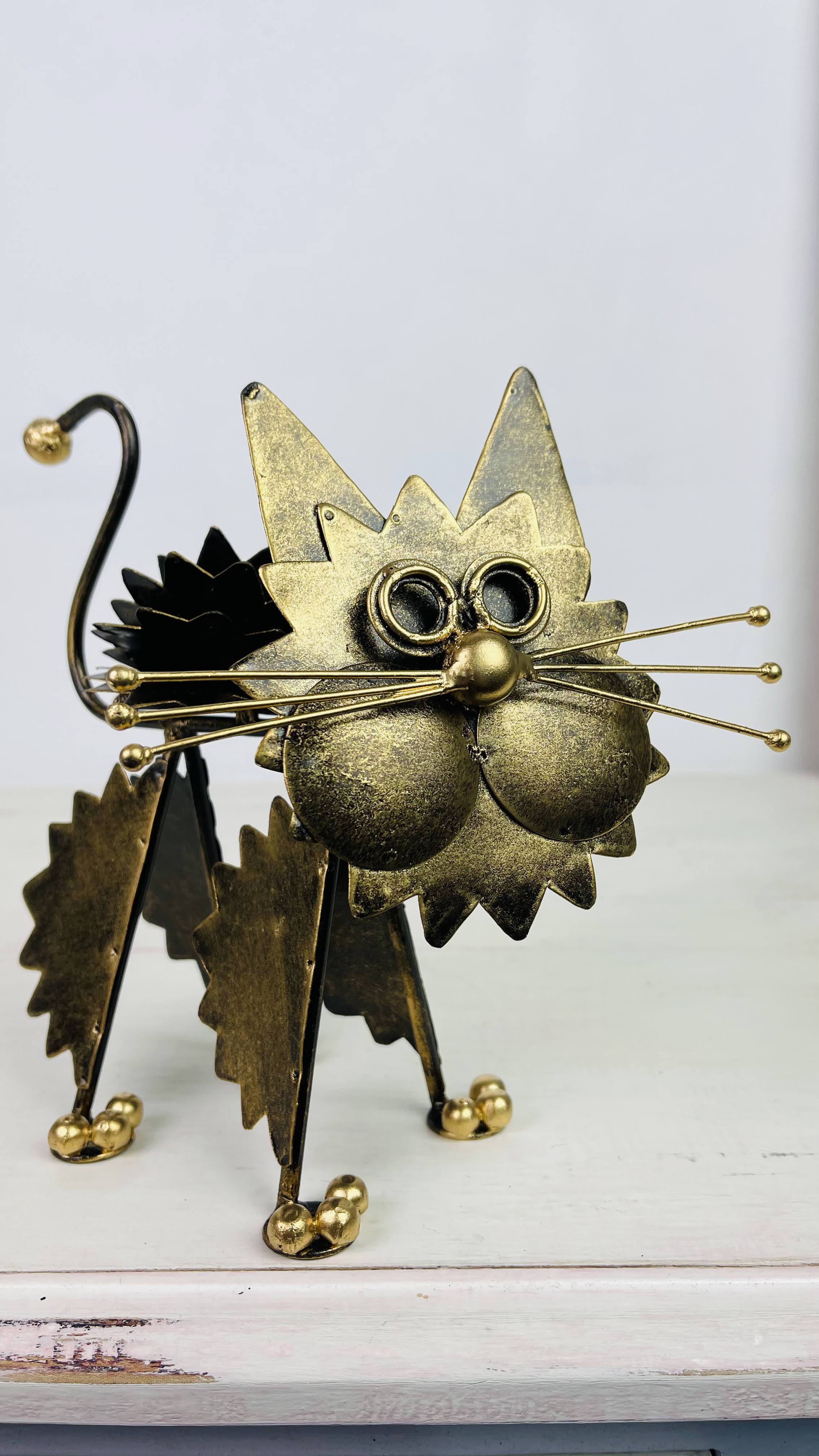 side front view of metal fluffy kitty