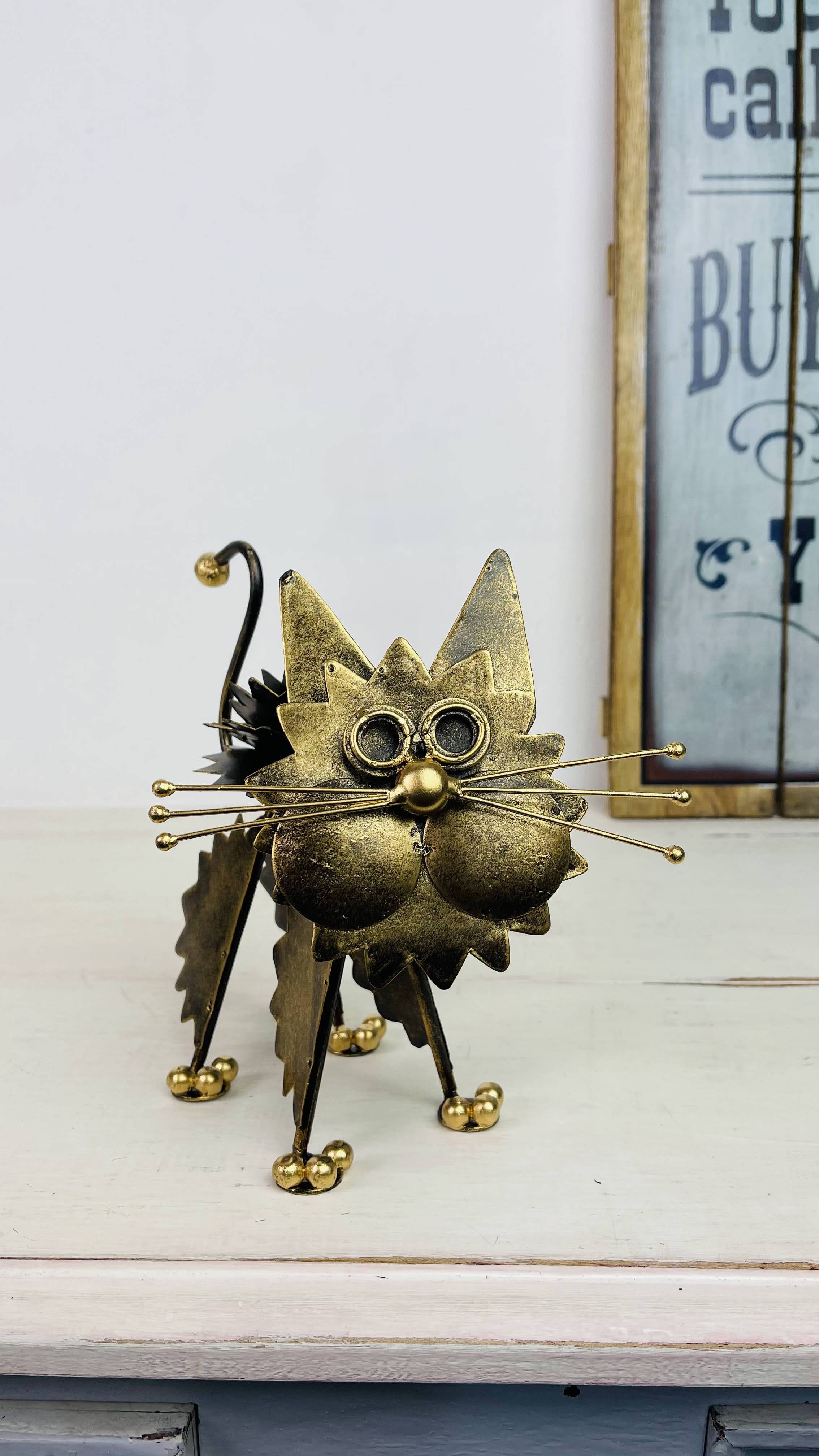 front view of metal fluffy kitty