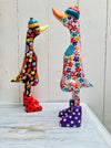 display side view of flower ducks in white and black