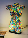 front view of mosaic bust lamp with light on
