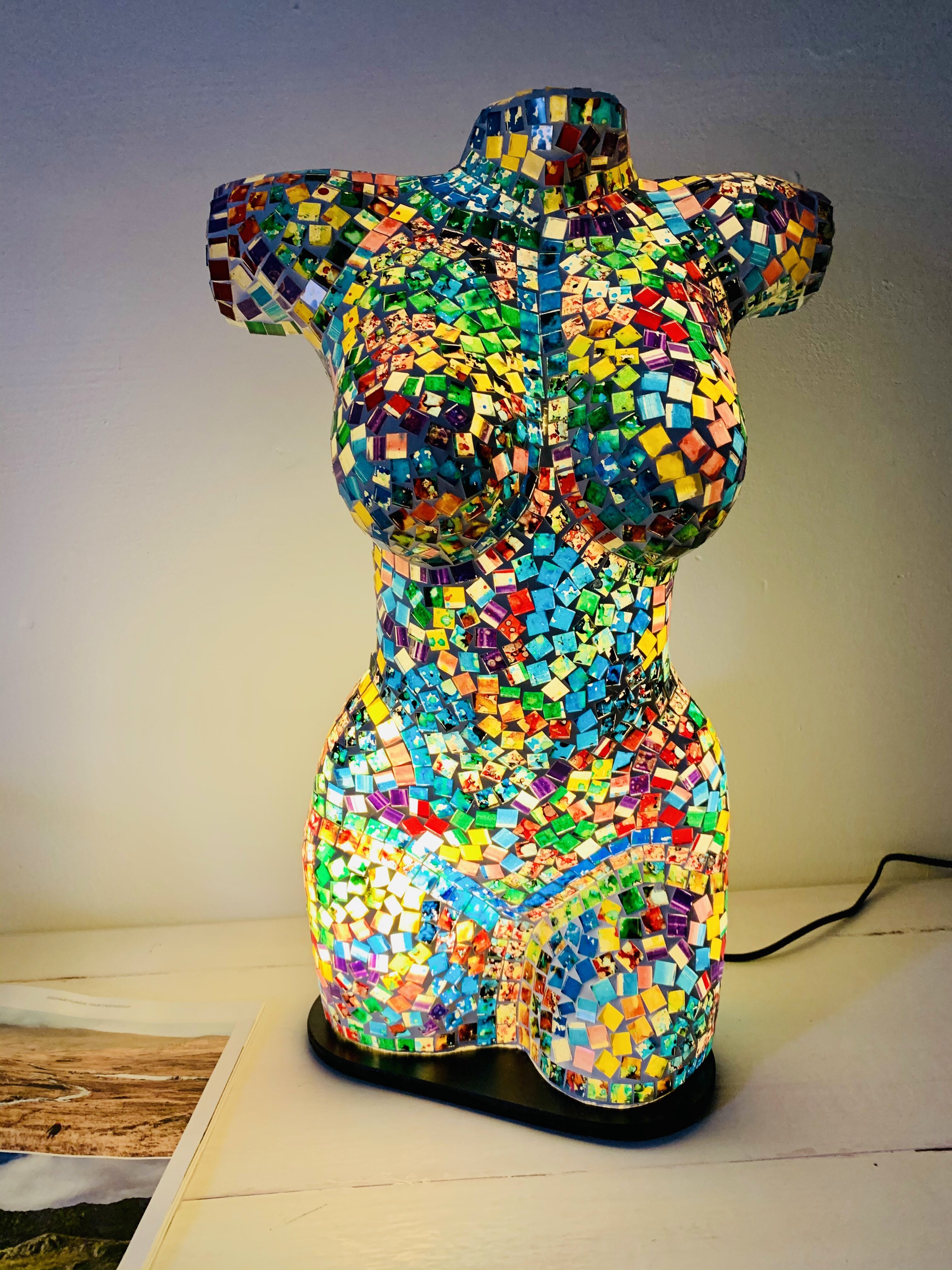 front view of mosaic bust lamp with light on