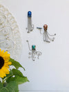 display set view of assorted octopuses on wall