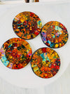aerial view set of round mosaic coasters on white background