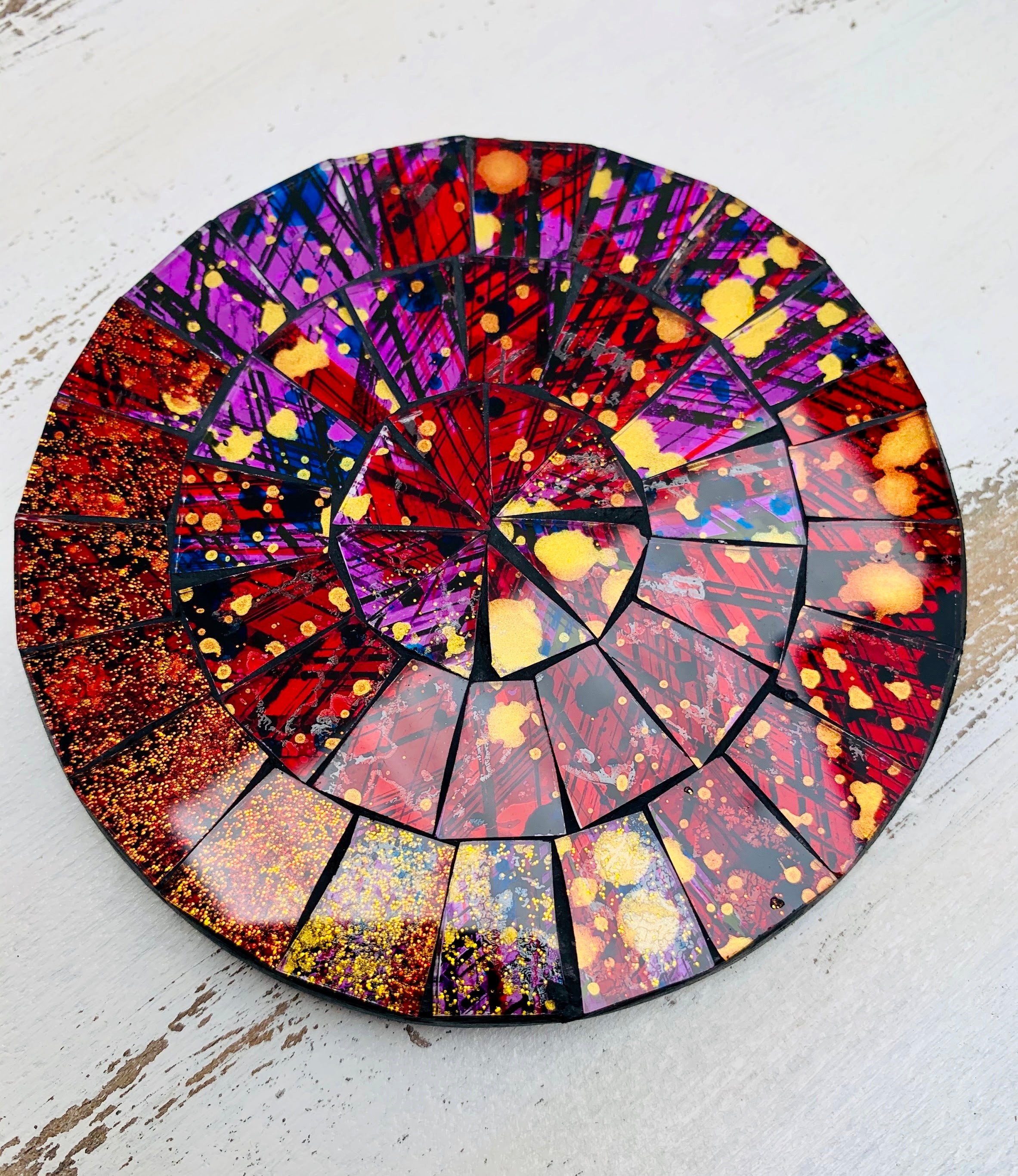 aerial close up of mosaic coaster in purple 