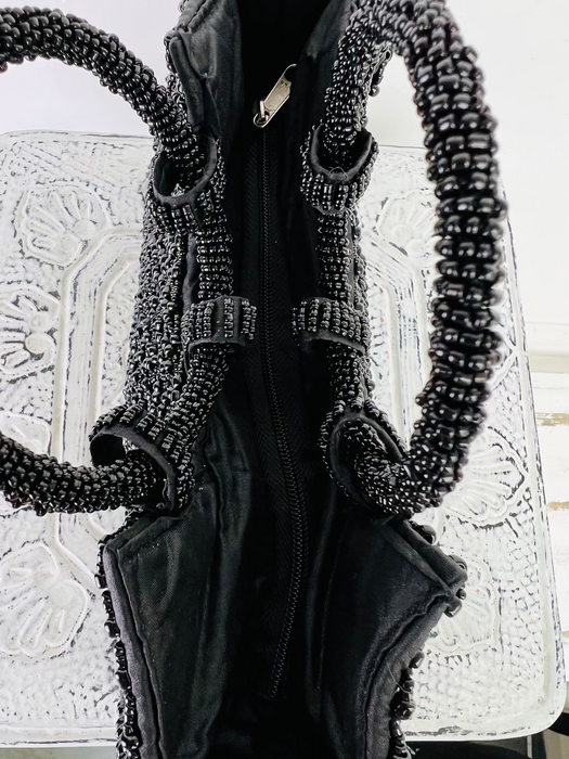 aerial view of beaded handbag and the zip