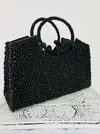 side front view of beaded handbag in black