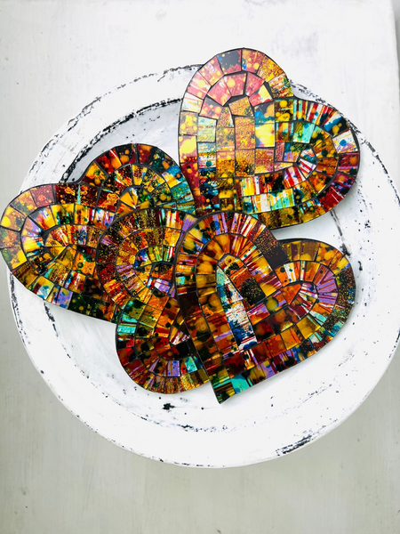 aerial view of mosaic heart coasters as a set