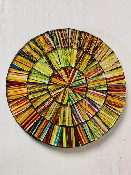 Hand-painted City Lights mosaic coaster with warm yellow, gold and earthy glass pieces on an MDF base, photographed from above on a light surface.