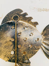 Back view of handmade copper metal fish hook.