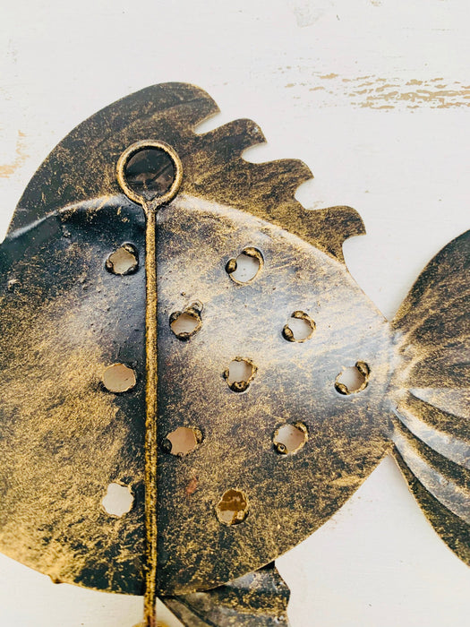 Back view of handmade copper metal fish hook.