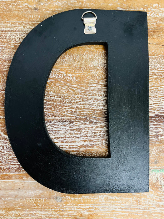 back of mosaic letter D