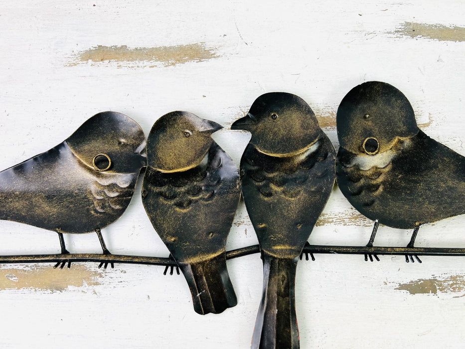 back view of metal garden birds with hooks attached to either sides