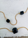 close-up of glass style cube bead necklace