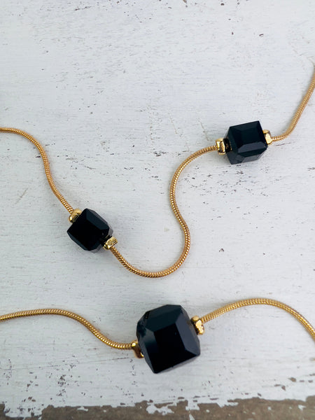 close-up of glass style cube bead necklace