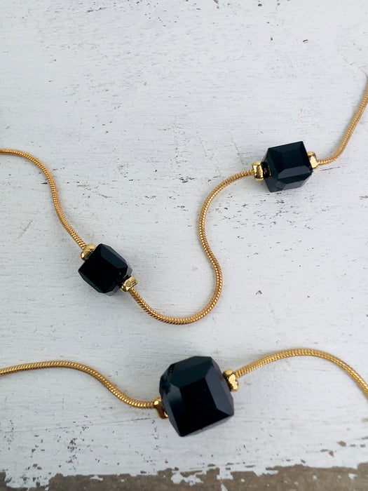 close-up of glass style cube bead necklace