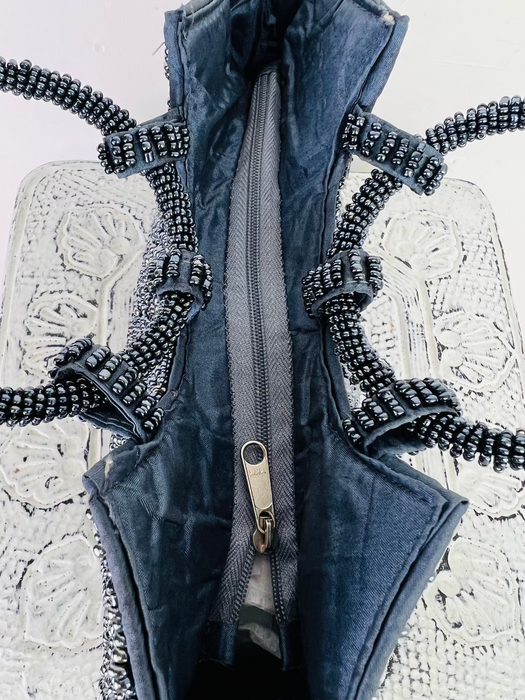 aerial view of beaded handbag with zip opening