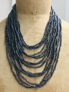 Bead statement waterfall style necklace with Navy Gunmetal seed beads and hand carved wood clasp. 