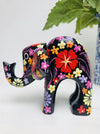 side view of black wooden flower elephant