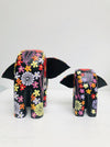 back view of small and large wooden flower elephants