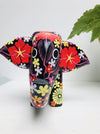 front view of black wooden flower elephant