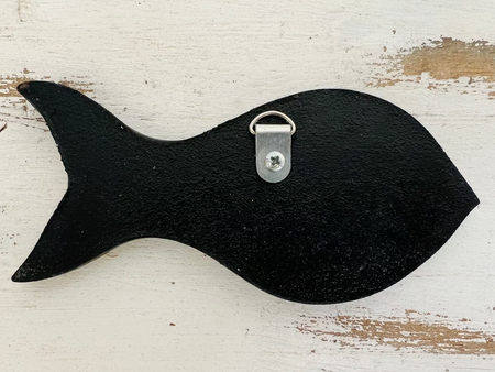 aerial view of base of mosaic fish with hook attached