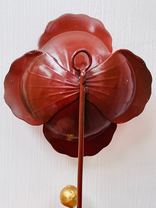 Back view of handmade red hibiscus metal wall hook.