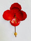Handmade red hibiscus flower wall hook with gold detailing.