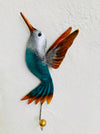 Handmade green humming bird hook with silver and rust detailing.