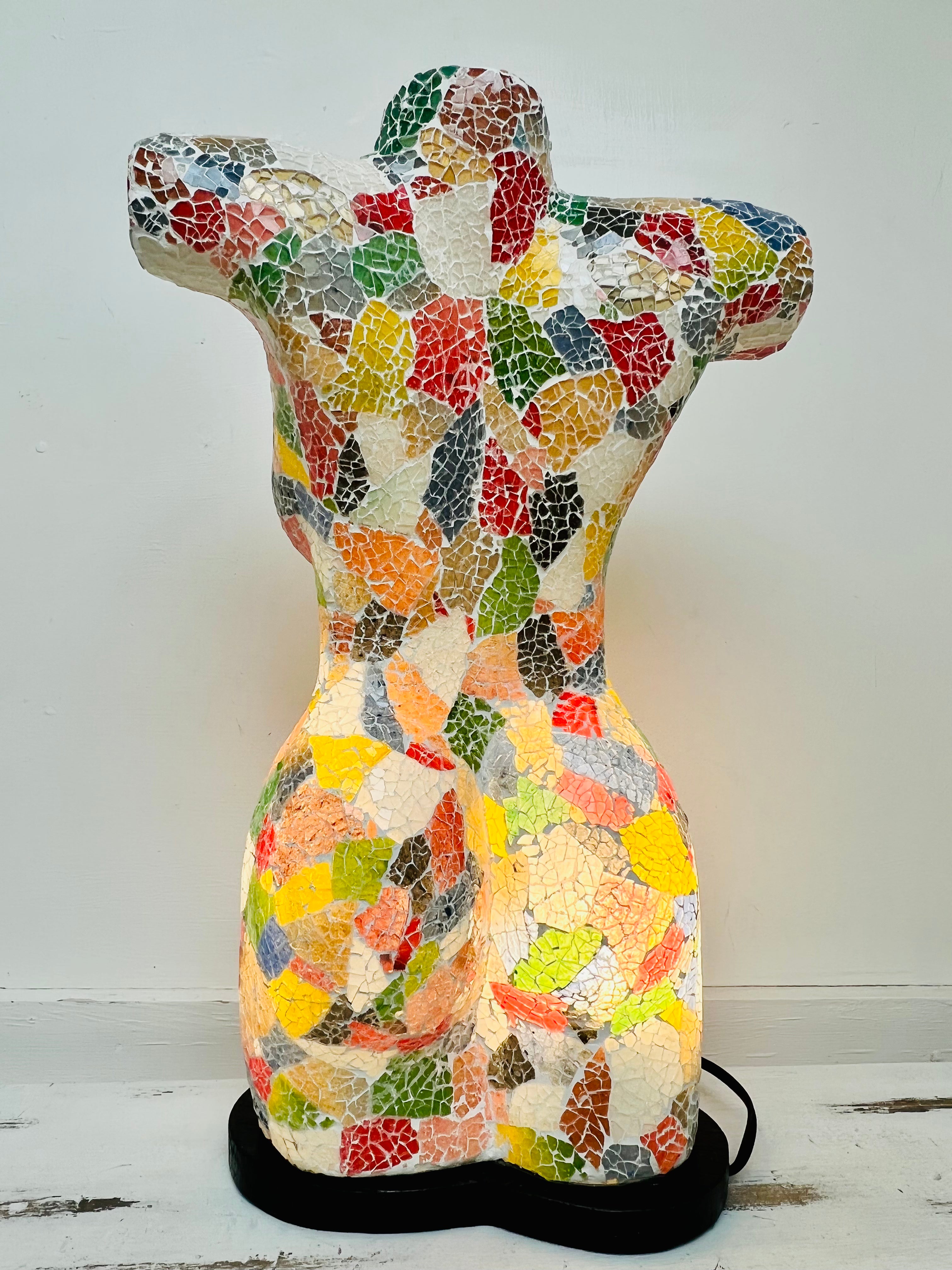 back view of mosaic bust lamp with light on