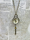 close up of watch on necklace