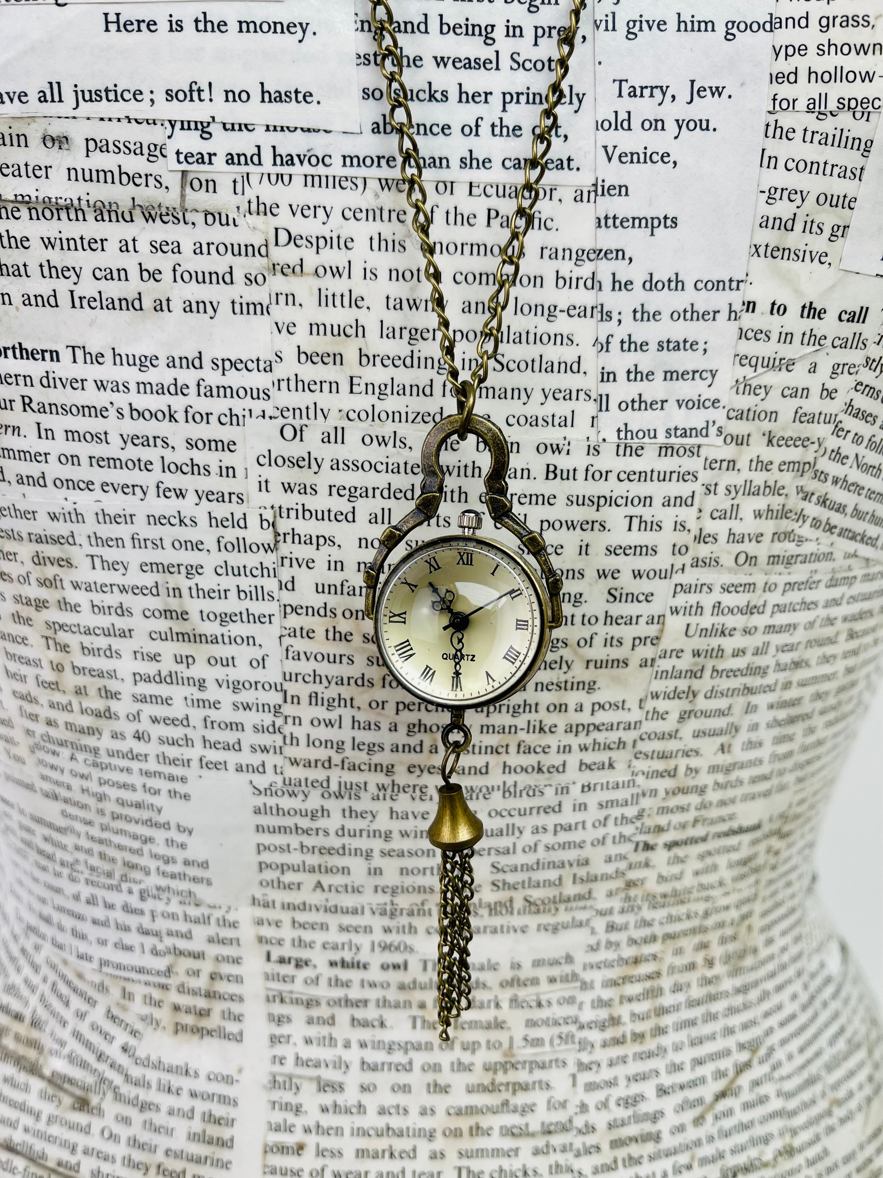 close up of watch on necklace
