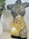 front view of mosaic bust lamp with light on