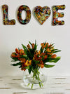 front view of mosaic love letters hung on wall