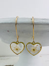 front view of pair of heart shaped earrings