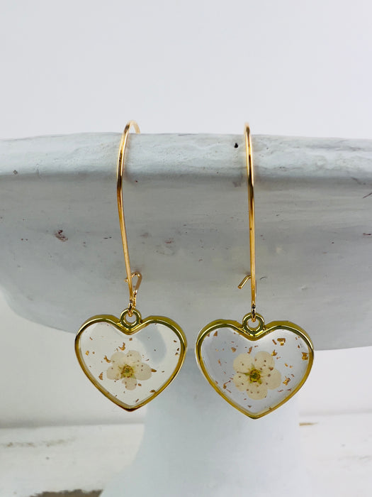 front view of pair of heart shaped earrings