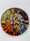 aerial view of round mosaic coaster on white background