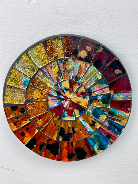 aerial view of round mosaic coaster on white background