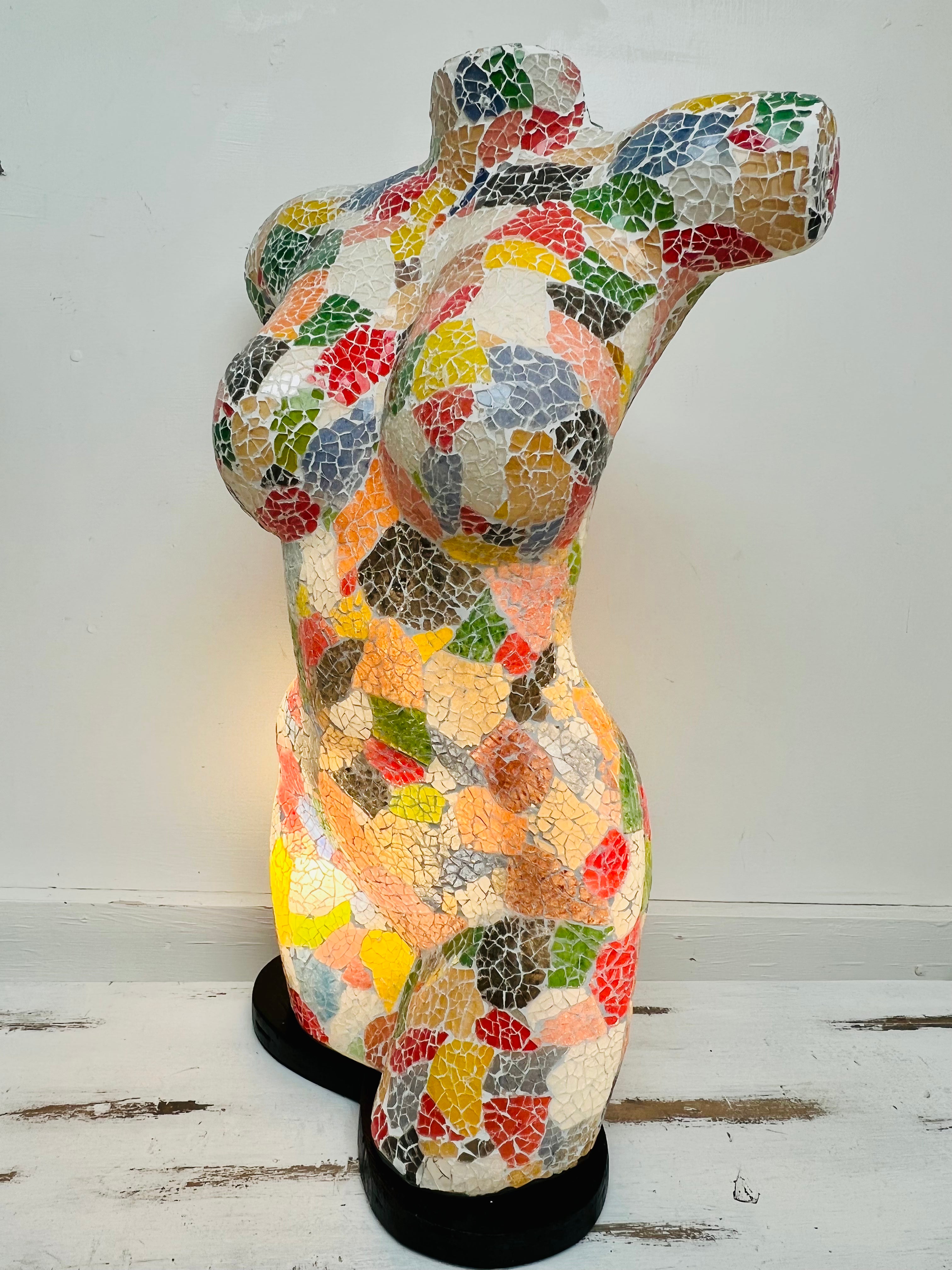 side view of mosaic bust lamp with light on