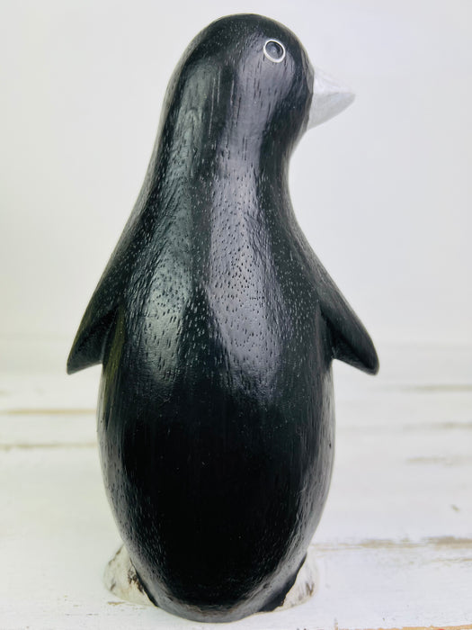 back view of wood penguin