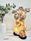 front view of mosaic bust lamp lit up on a white background