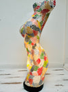 side view of mosaic bust lamp with light on