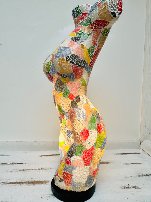 side view of mosaic bust lamp with light on